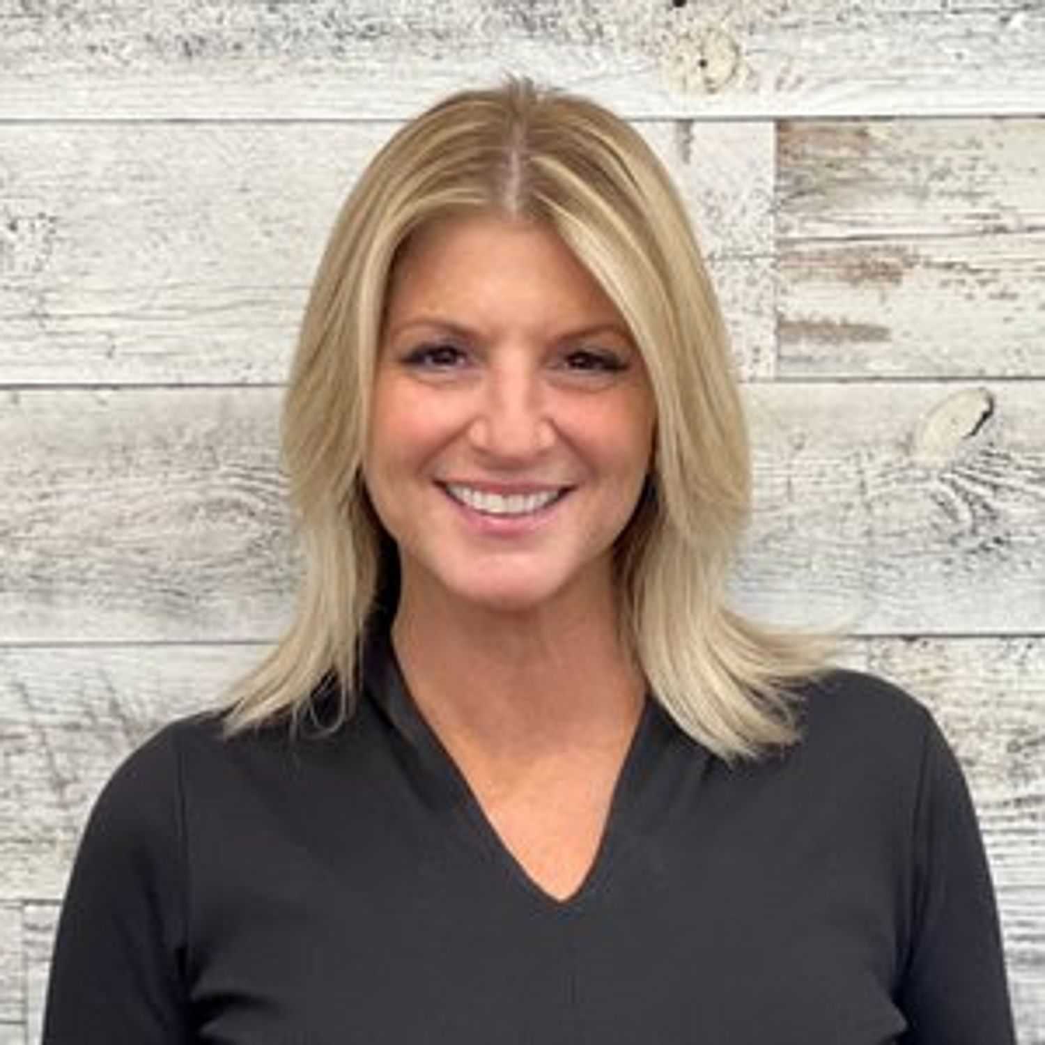 Portrait of Julie, a professional stylist at Spark Salon, showcasing their expertise and style.