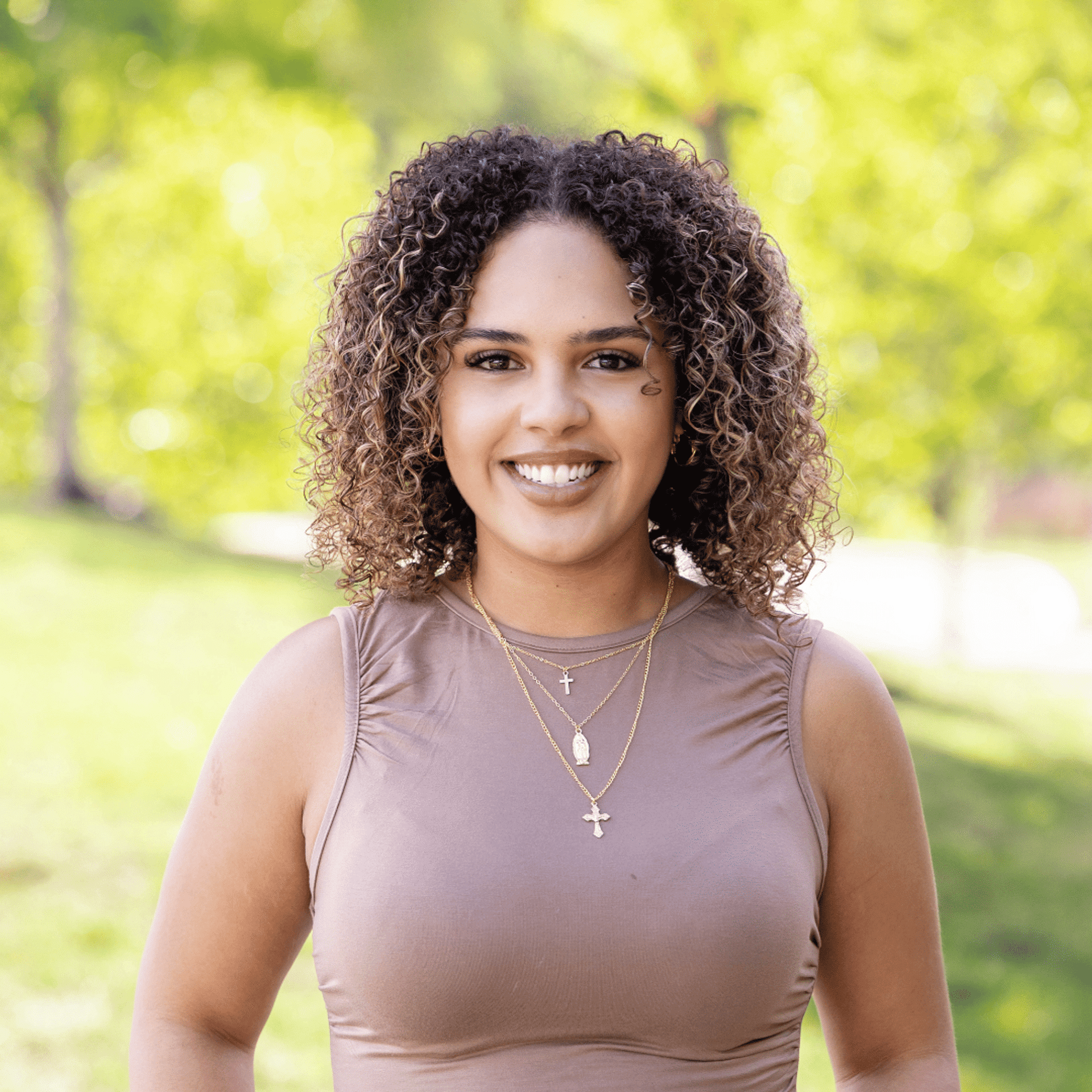 Portrait of Ashanti, a professional stylist at Spark Salon, showcasing their expertise and style.