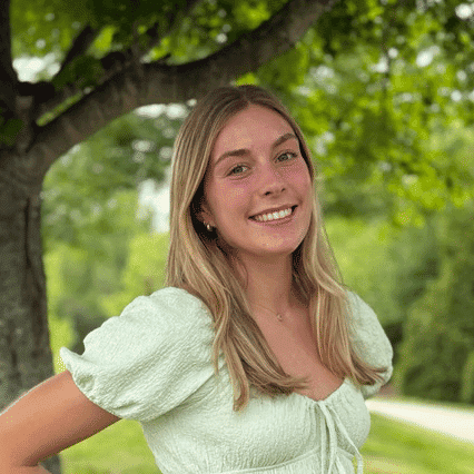 Portrait of Sydney, a professional stylist at Spark Salon, showcasing their expertise and style.
