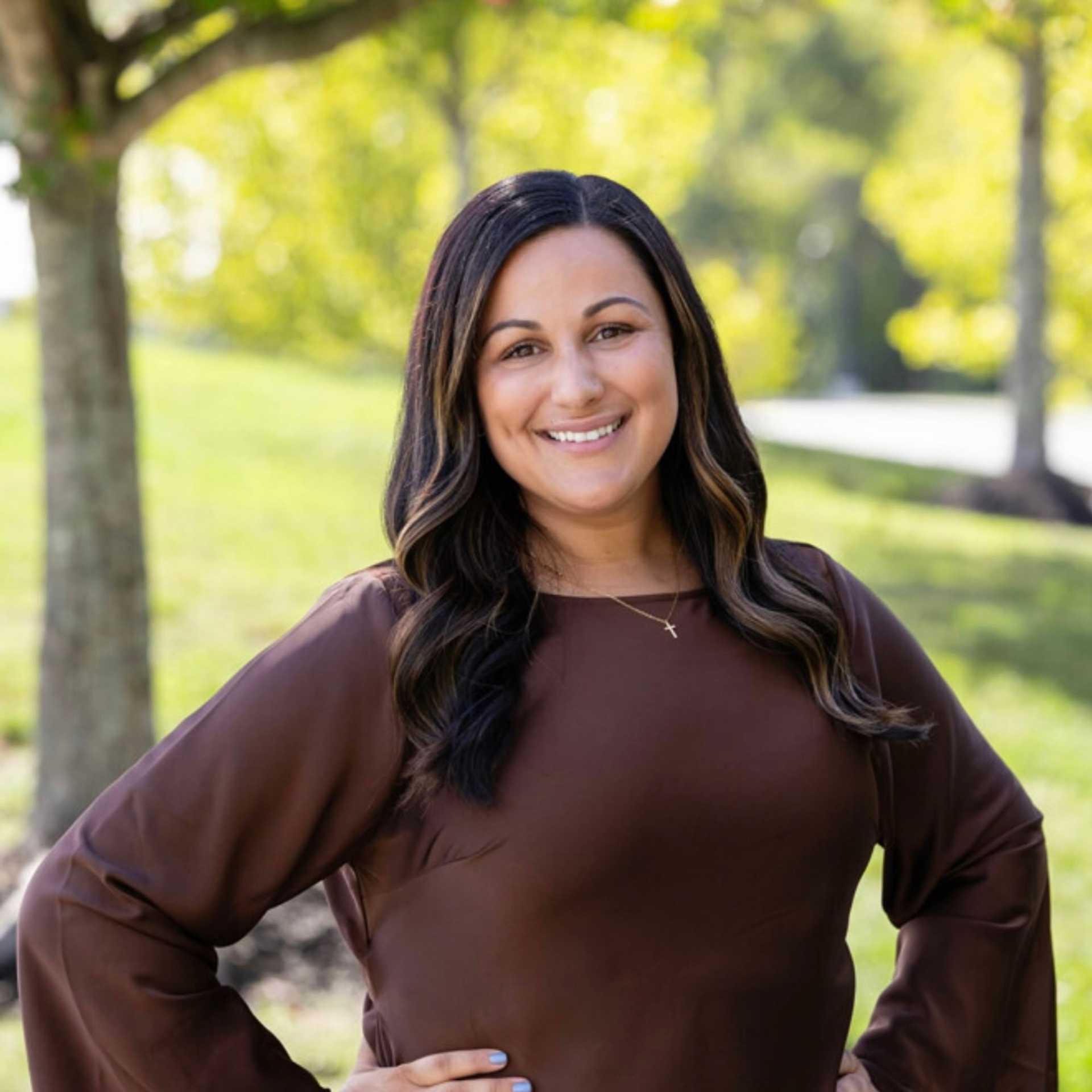 Portrait of Seana, a professional stylist at Spark Salon, showcasing their expertise and style.