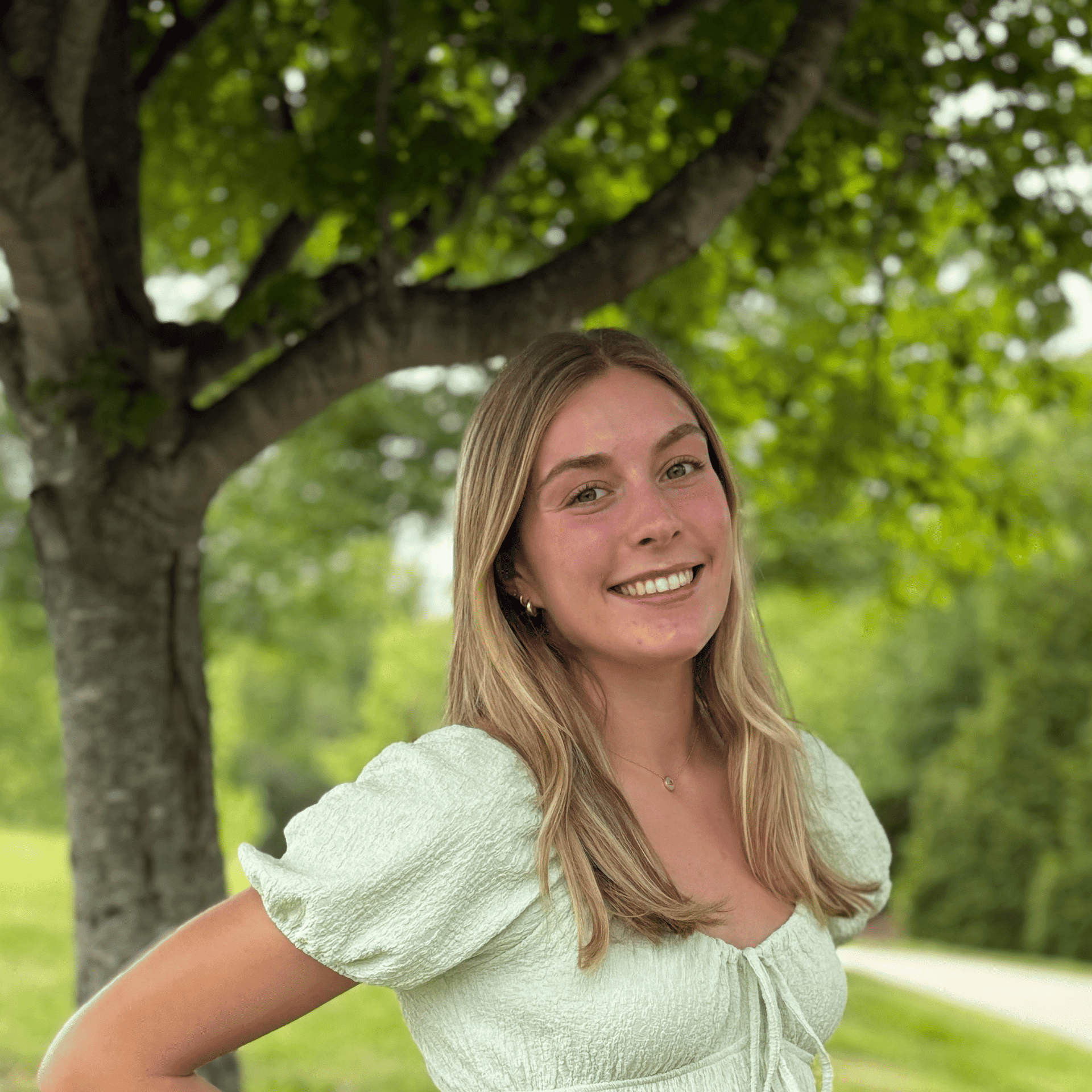 Portrait of Sydney, a professional stylist at Spark Salon, showcasing their expertise and style.