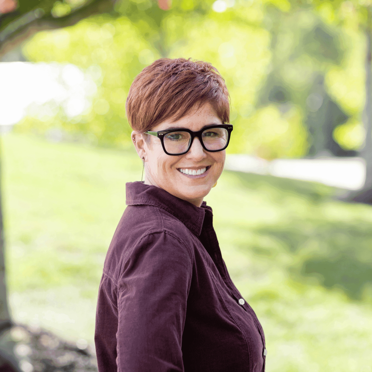 Portrait of Aimee, a professional stylist at Spark Salon, showcasing their expertise and style.