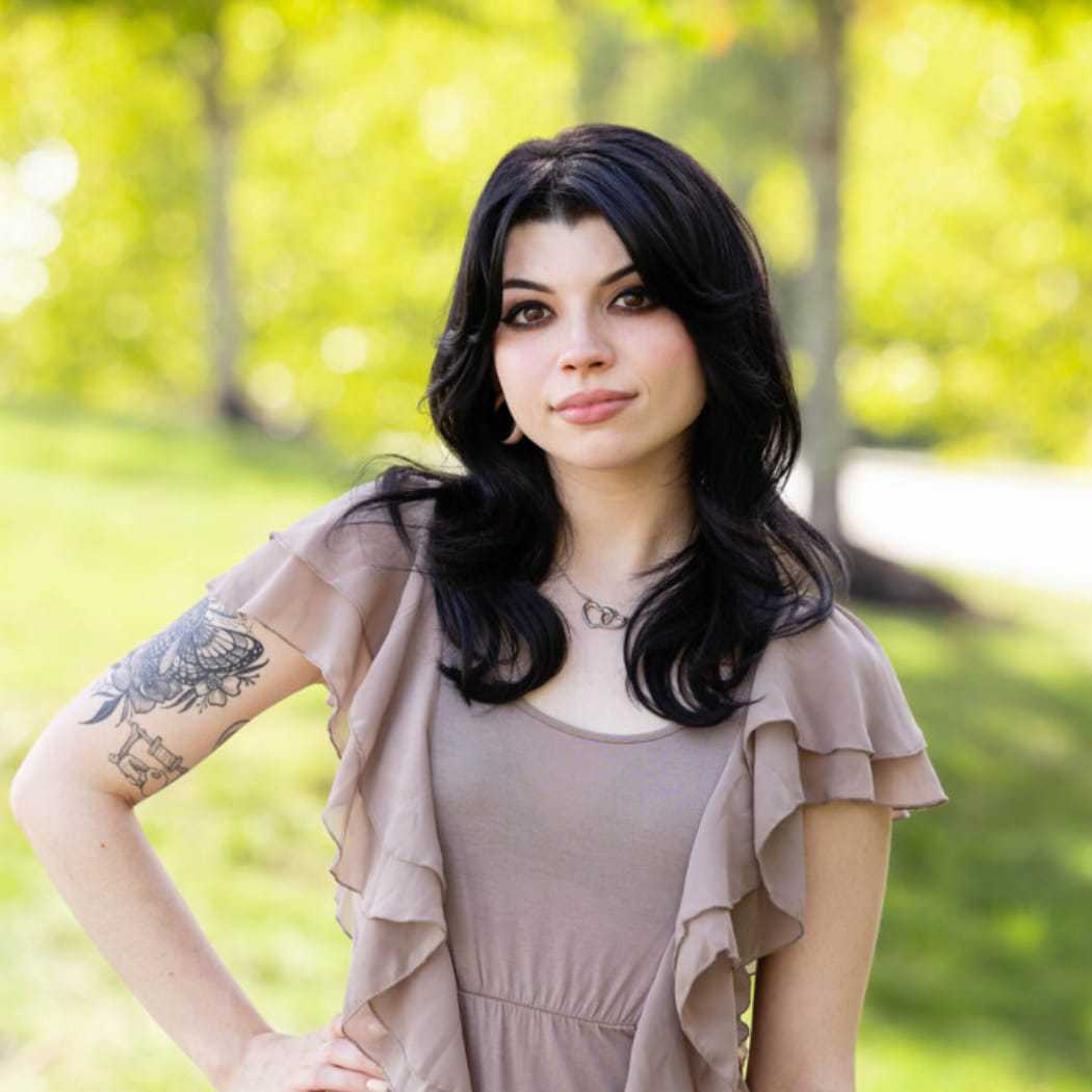 Portrait of Brittney, a professional stylist at Spark Salon, showcasing their expertise and style.