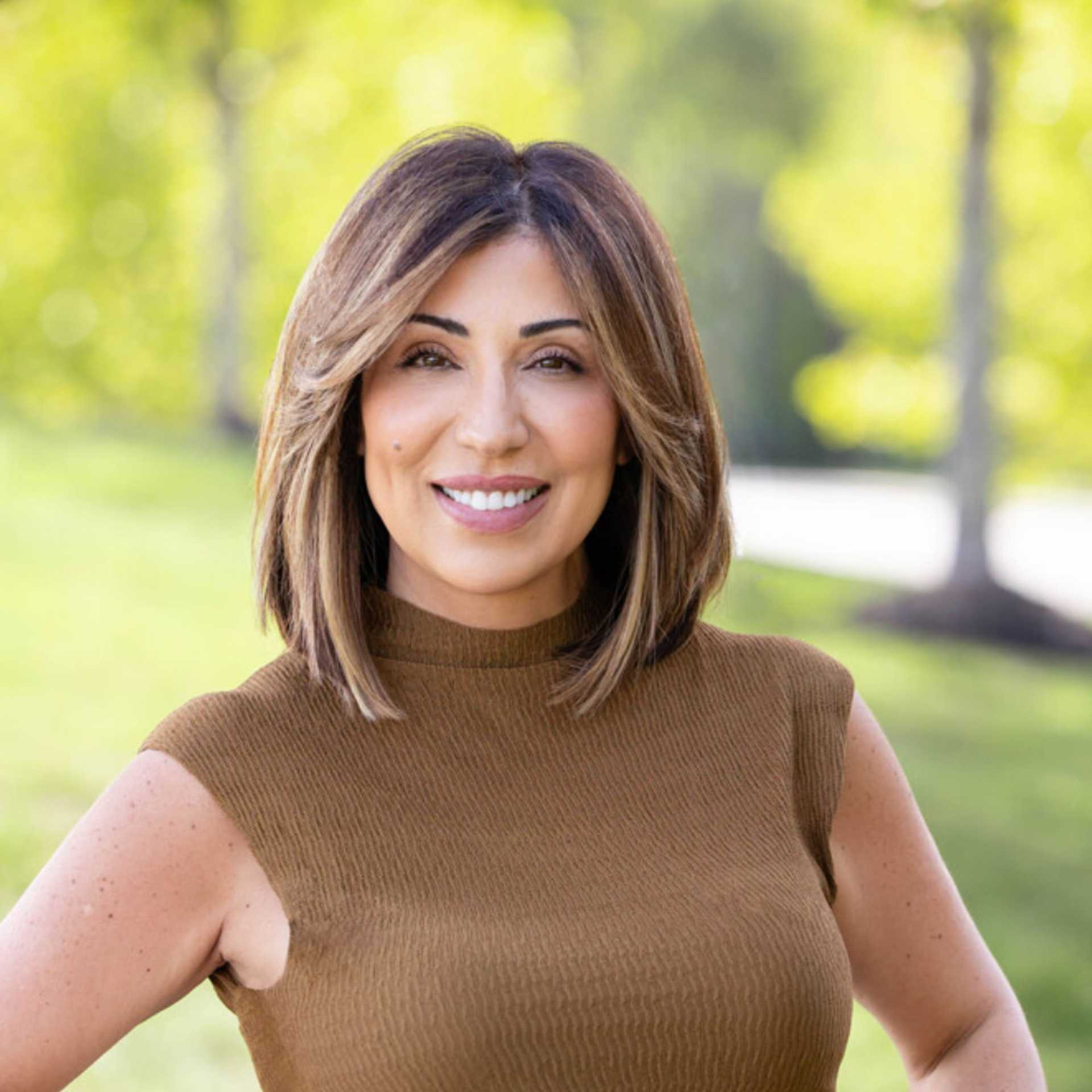 Portrait of Maria, a professional stylist at Spark Salon, showcasing their expertise and style.