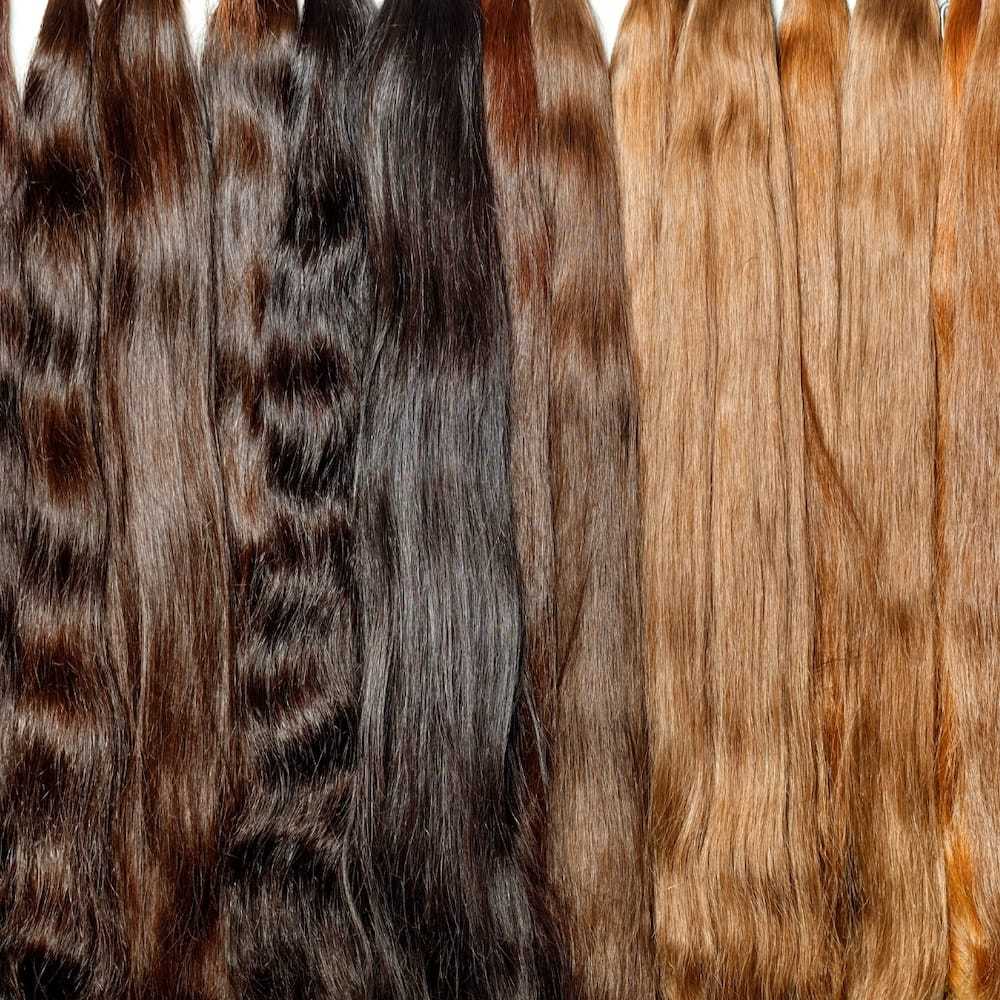 Various hair weaves in different colors and textures.