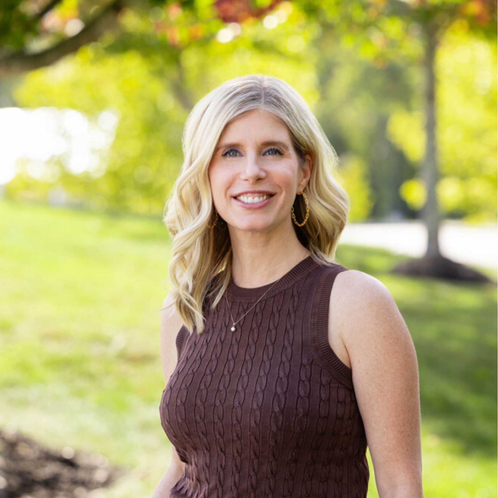 Portrait of Traci, a professional stylist at Spark Salon, showcasing their expertise and style.