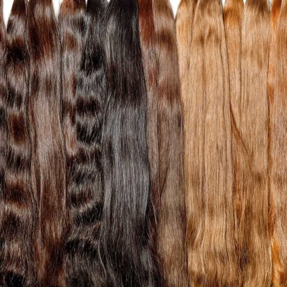 Various hair weaves in different colors and textures.