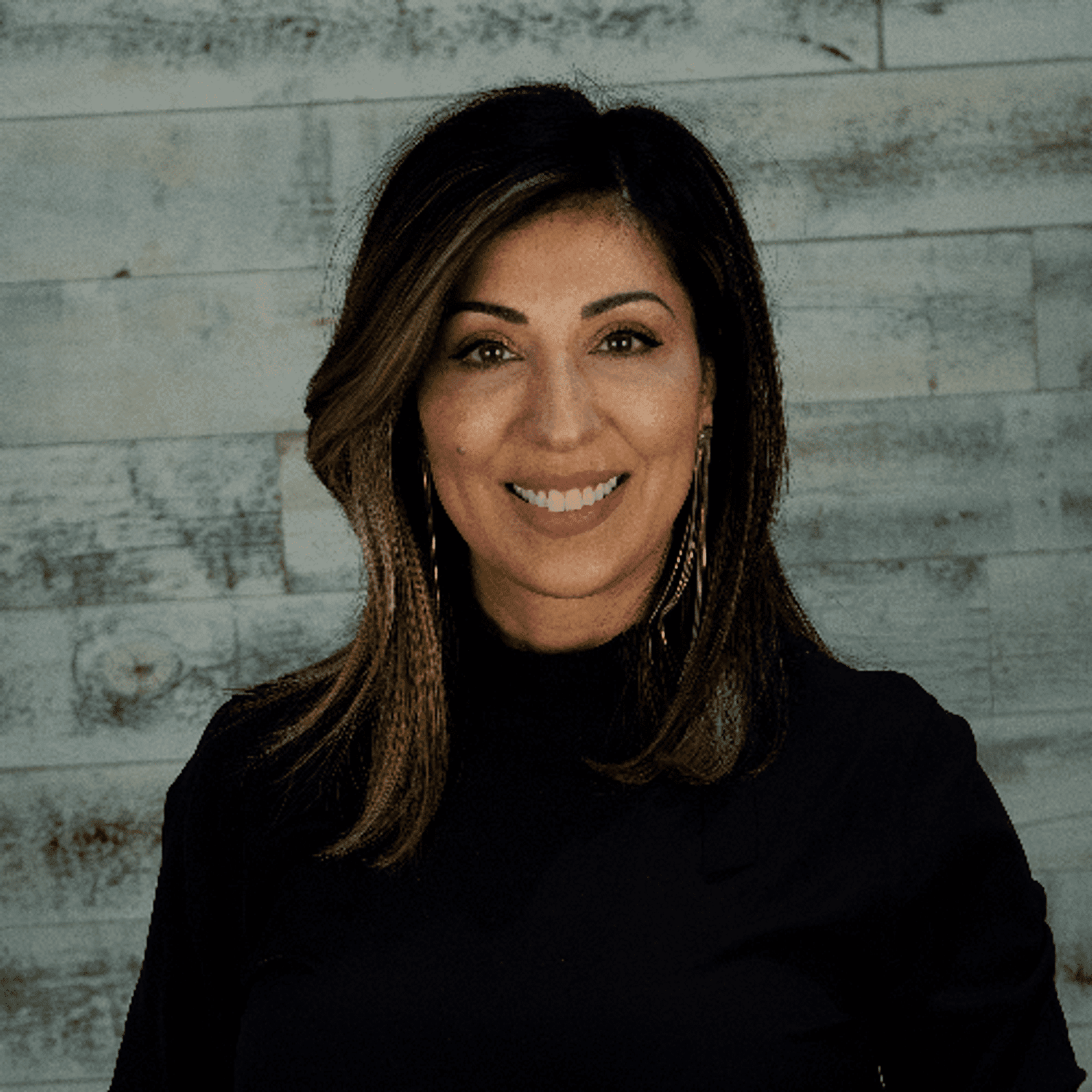 Portrait of Maria, a professional stylist at Spark Salon, showcasing their expertise and style.