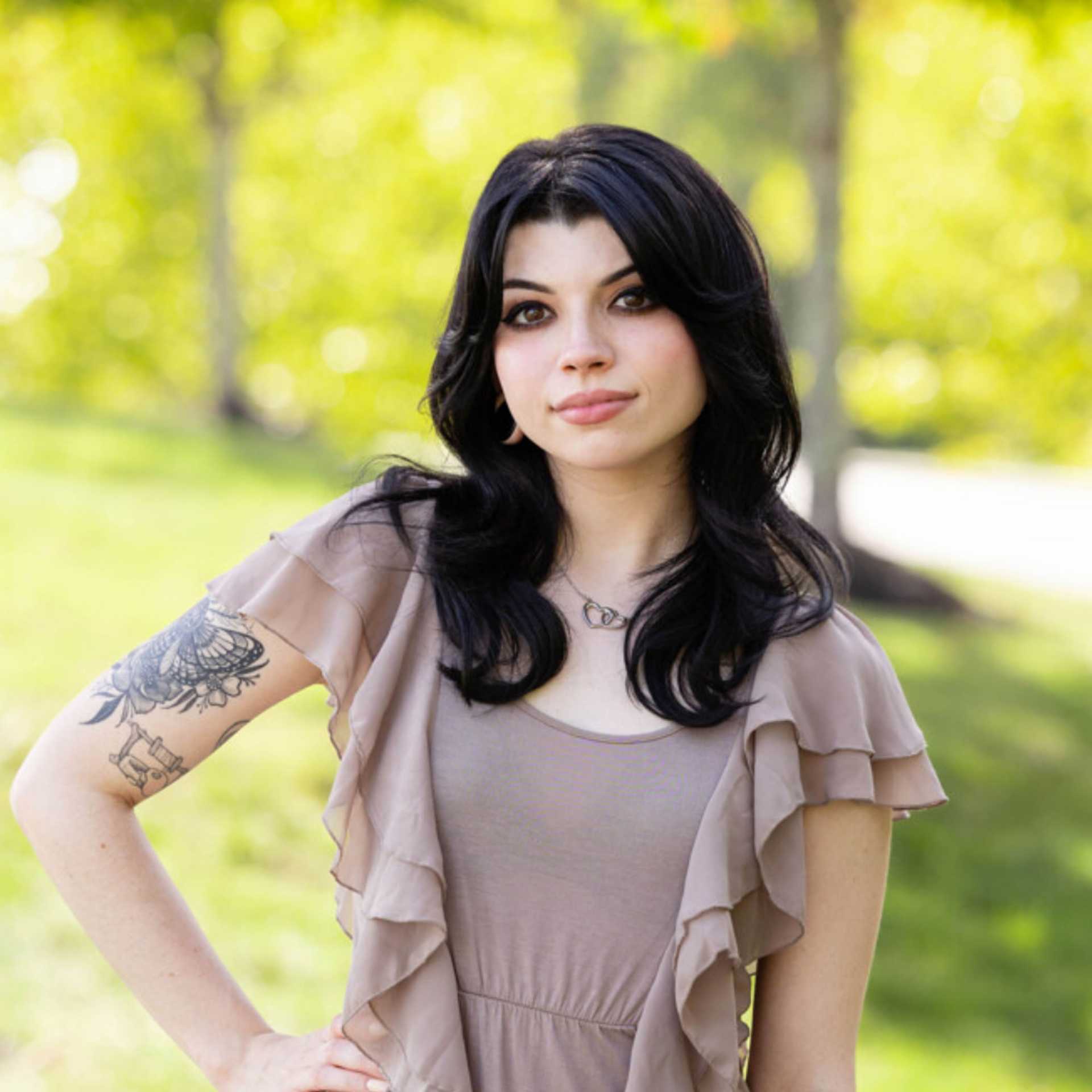 Portrait of Brittney, a professional stylist at Spark Salon, showcasing their expertise and style.