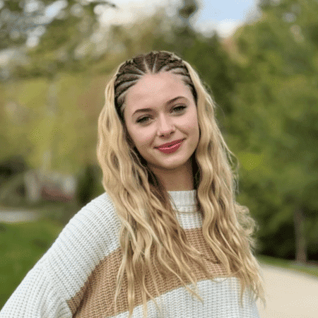 Portrait of Kyla, a professional stylist at Spark Salon, showcasing their expertise and style.