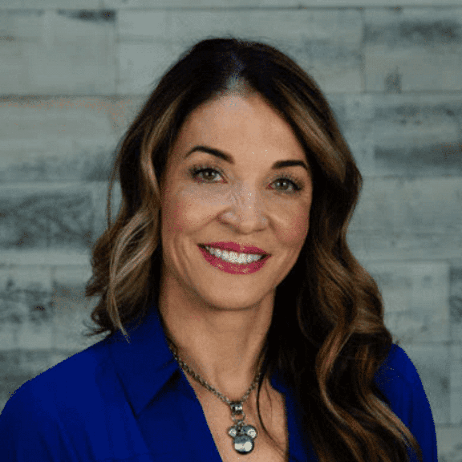 Portrait of Gina, a professional stylist at Spark Salon, showcasing their expertise and style.