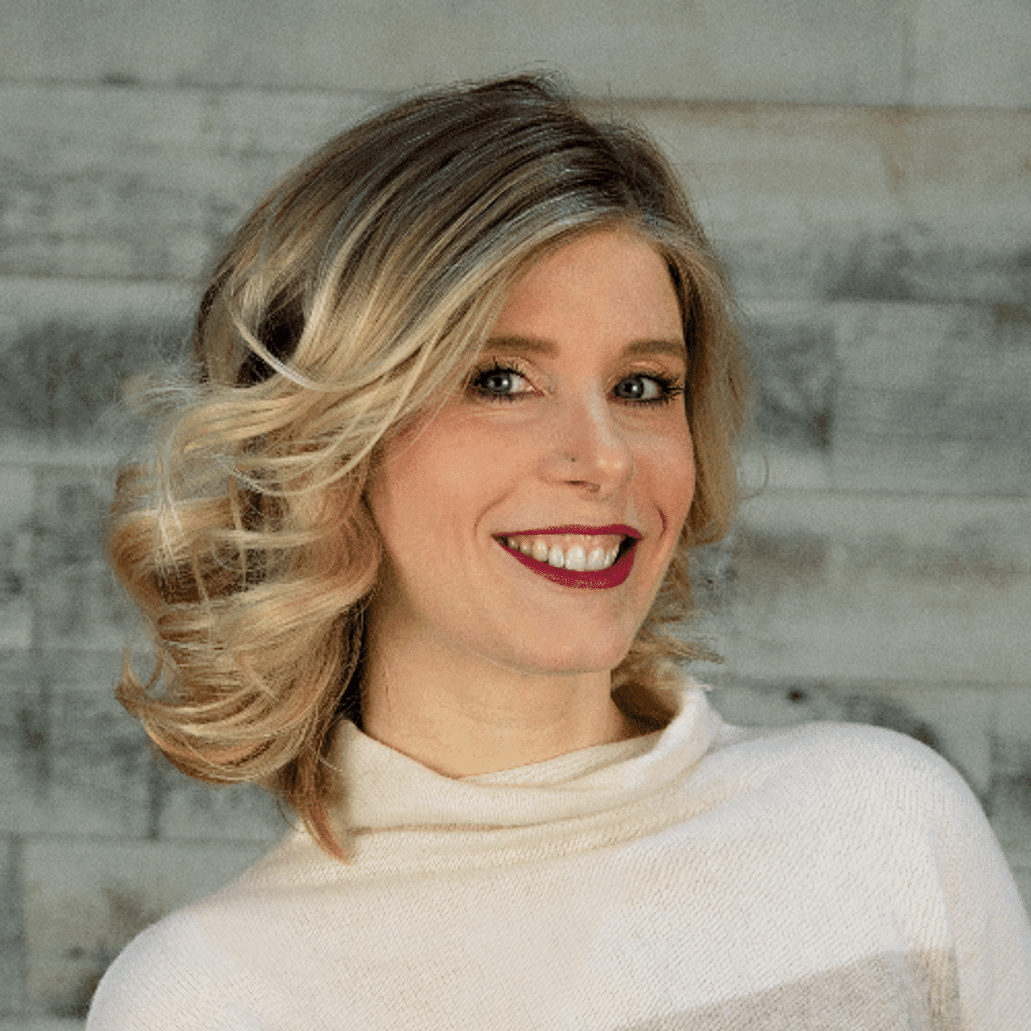 Portrait of Traci, a professional stylist at Spark Salon, showcasing their expertise and style.